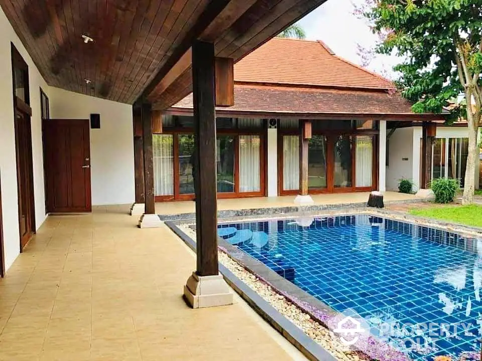 Stunning villa with private pool and spacious patio, perfect for luxurious living.