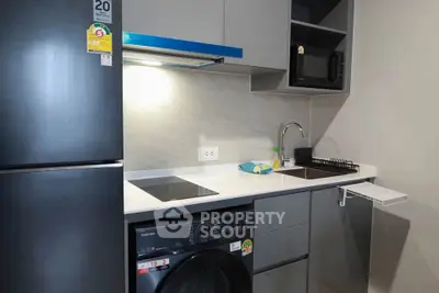 Modern compact kitchen with sleek appliances and efficient layout