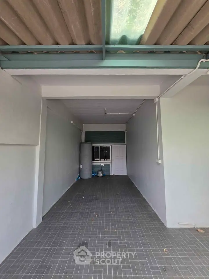 Spacious garage with tiled flooring and ample storage space