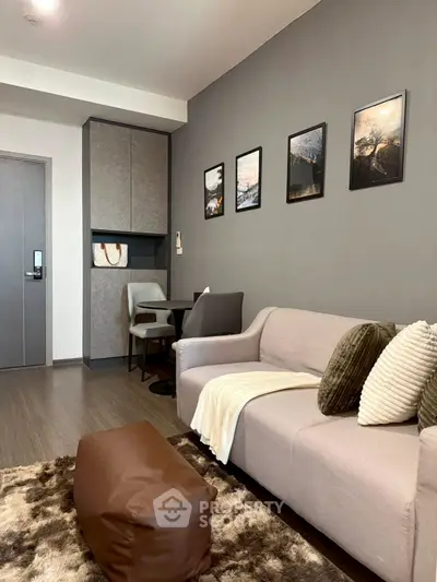 Modern living room with stylish decor and cozy seating area in a contemporary apartment.