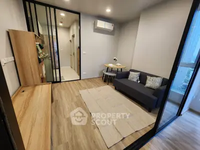 Modern living room with sleek design and cozy seating area