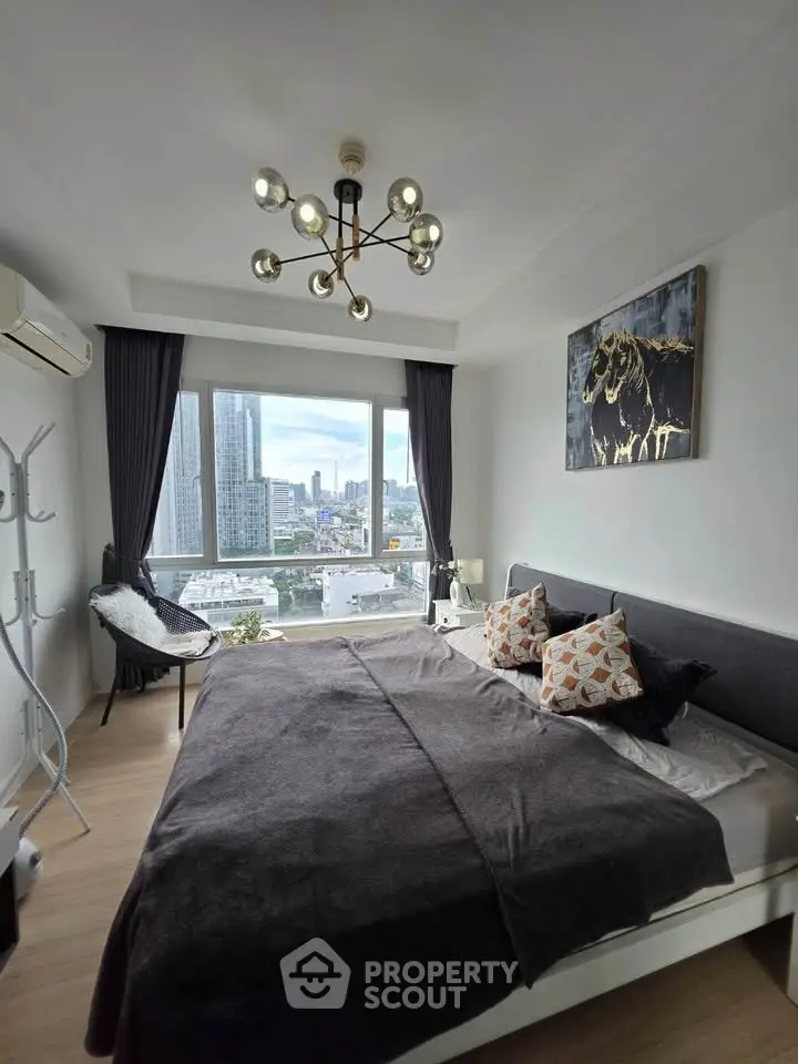 Modern bedroom with city view, stylish decor, and large windows in a high-rise apartment.