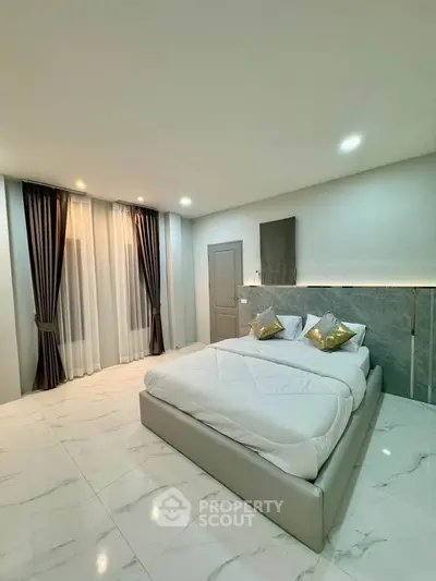 Luxurious modern bedroom with elegant decor and marble flooring
