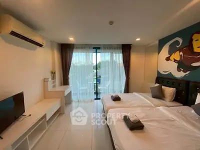 Spacious modern bedroom with balcony and stylish decor, perfect for comfort and relaxation.