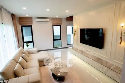 Luxurious modern living room with elegant decor and large windows