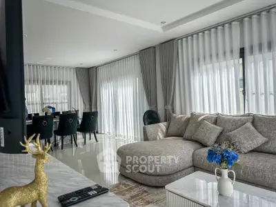 Luxurious living room with elegant decor and spacious seating area, perfect for relaxation and entertainment.