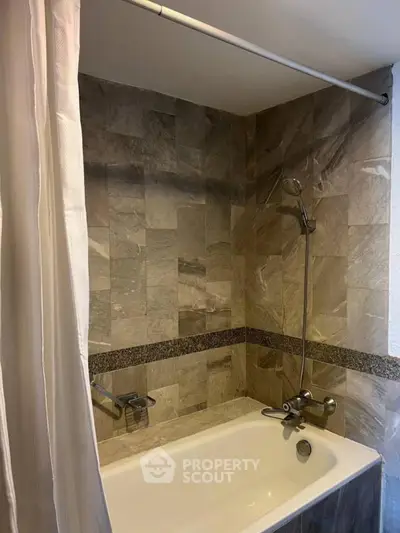 Elegant bathroom with modern bathtub and stylish tile design