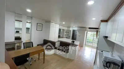 Spacious modern studio apartment with open layout and balcony view.