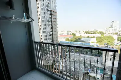 Modern balcony with city view in high-rise apartment