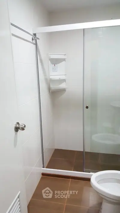 Modern bathroom with glass shower enclosure and sleek design