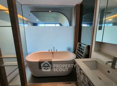 Luxurious modern bathroom with freestanding bathtub and sleek design