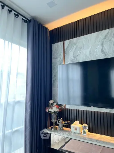 Elegant living room with modern TV setup and stylish decor