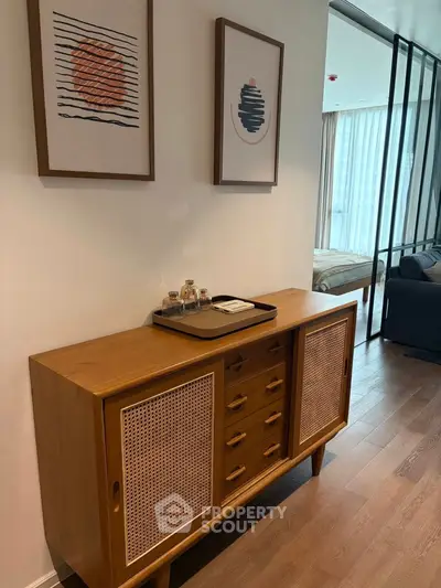 Stylish interior with wooden sideboard and modern art in a cozy living space
