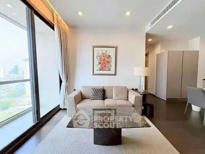 Modern living room with large windows and city view, featuring elegant decor and comfortable seating.
