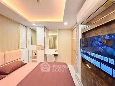 Luxurious bedroom with modern decor and wall-mounted TV