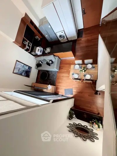 Modern loft apartment with stylish decor and open layout, featuring a cozy living area and dining space.
