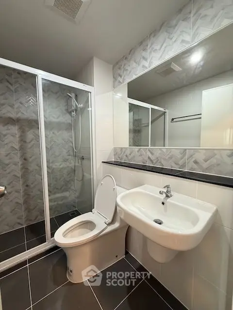 Modern bathroom with sleek shower and stylish tile design