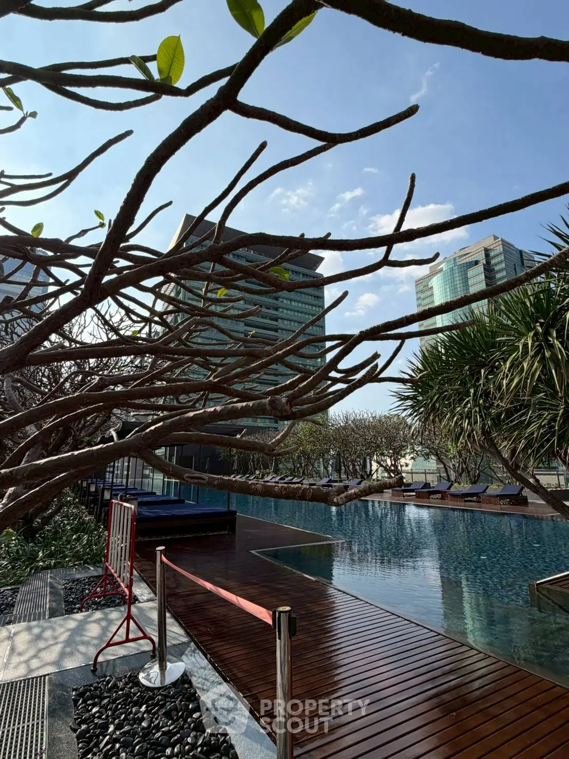 Luxurious rooftop pool with stunning cityscape view and modern design.