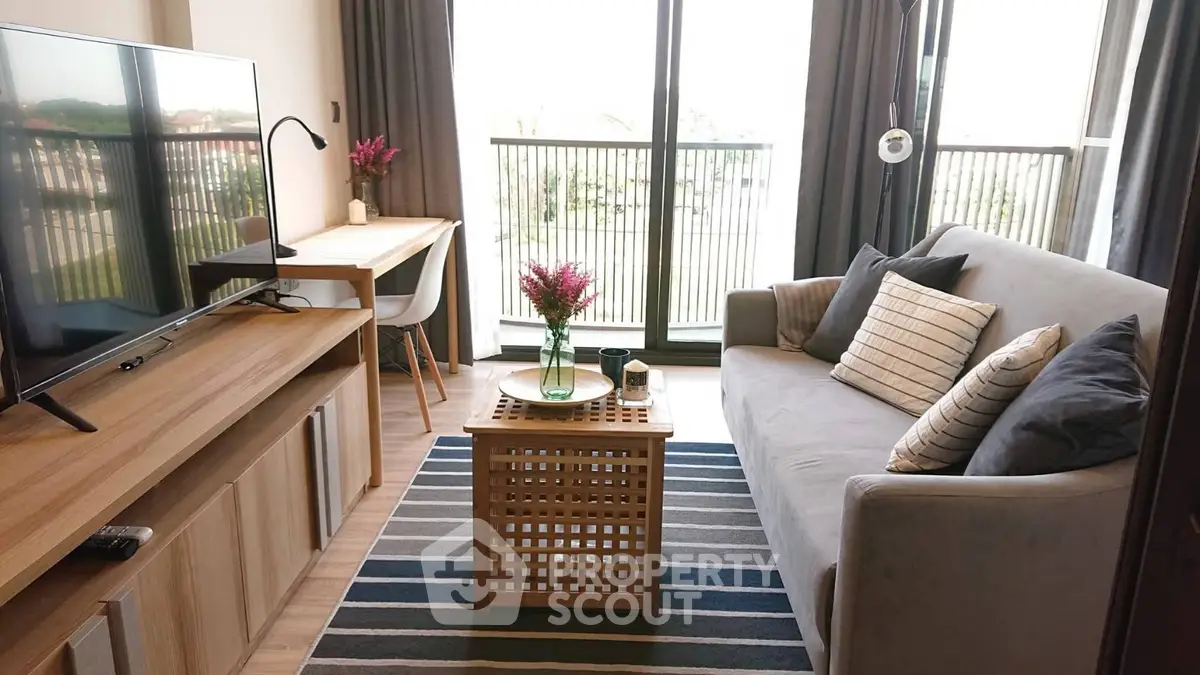Modern living room with stylish decor and balcony view