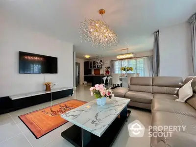 Luxurious modern living room with elegant chandelier and marble coffee table