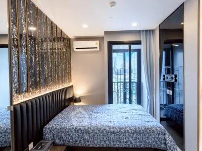 Modern bedroom with stylish decor and city view balcony access
