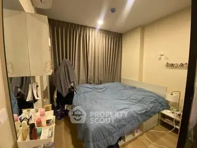 Cozy bedroom with modern decor and ample storage space