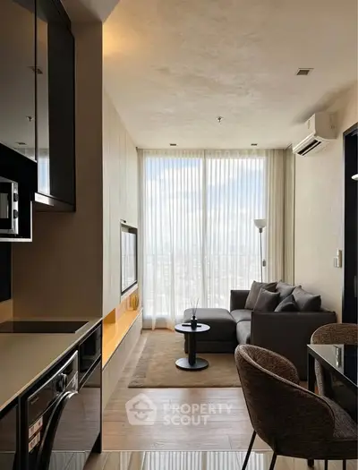 Modern living room with floor-to-ceiling windows and stylish furniture in a high-rise apartment.