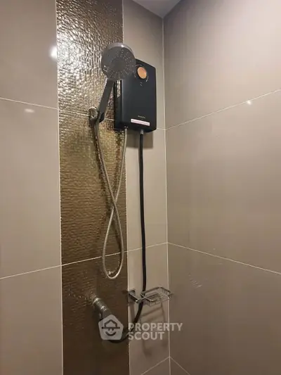 Modern bathroom with sleek showerhead and elegant tile design