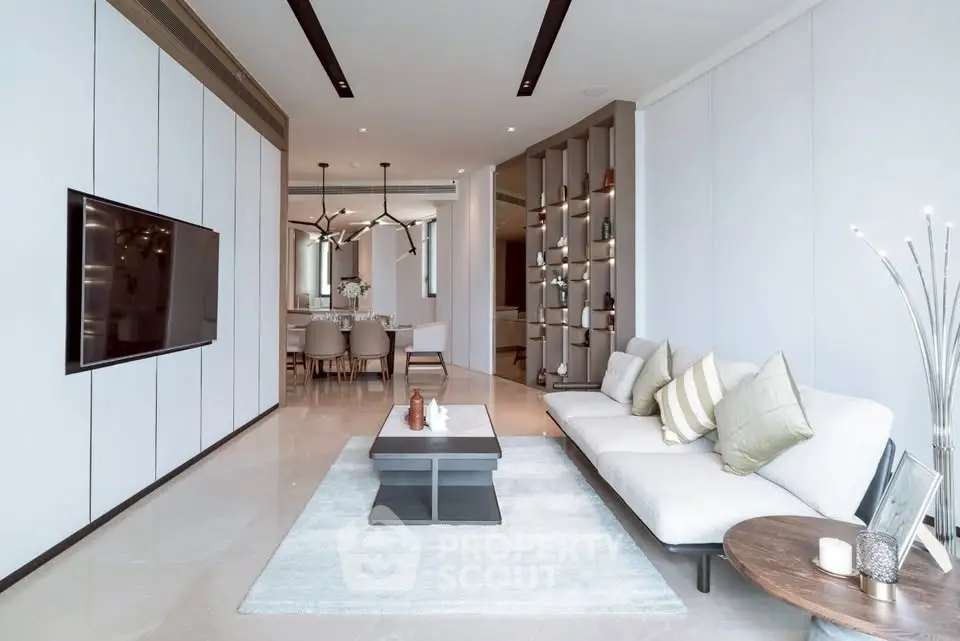 Luxurious modern living room with elegant decor and spacious dining area, perfect for stylish urban living.