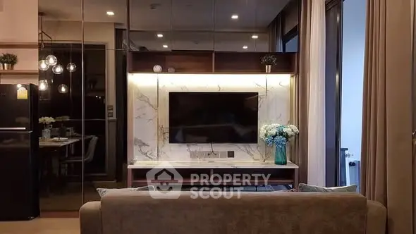 Modern living room with stylish decor and wall-mounted TV