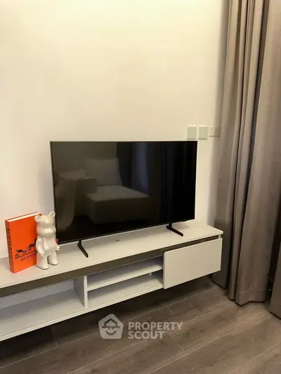 Modern living room with sleek TV setup and stylish decor