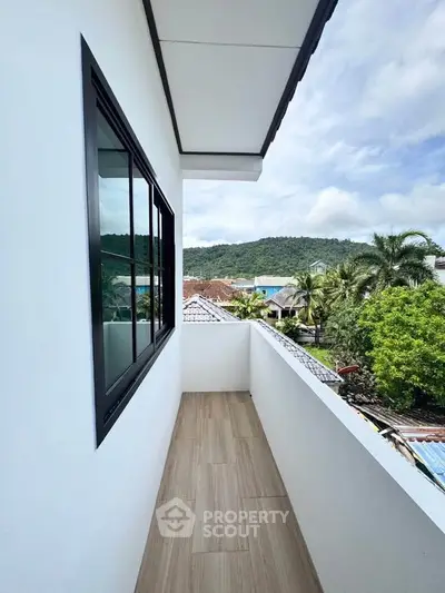 Charming balcony with scenic mountain view, perfect for relaxation and enjoying nature's beauty.