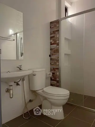 Modern bathroom with sleek design and glass shower enclosure