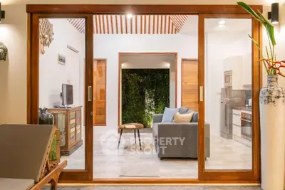 Stunning open-plan living room with sliding glass doors and modern decor