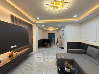 Spacious modern living room with elegant lighting and sleek furniture design