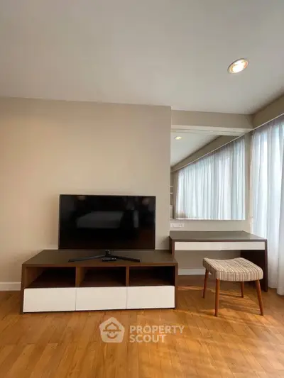 Modern living room with TV stand and stylish furniture