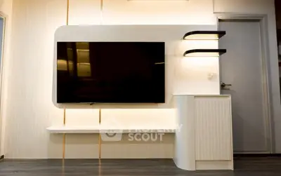 Modern living room with sleek TV setup and stylish lighting