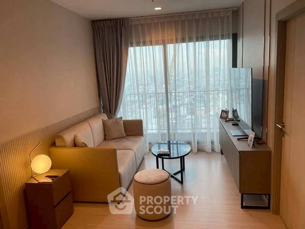 Modern living room with city view, cozy sofa, and sleek decor