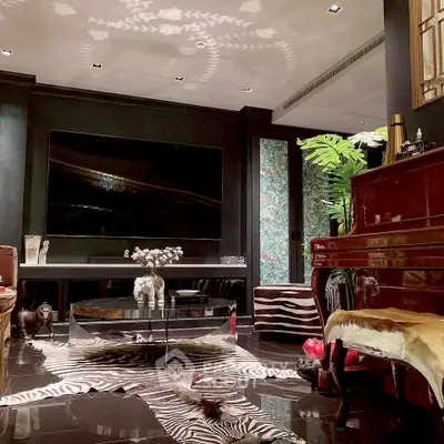 Luxurious living room with elegant decor, grand piano, and zebra rug, perfect for sophisticated entertaining.