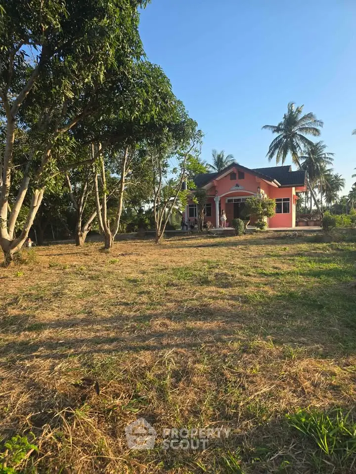 Charming countryside home with lush garden and tropical trees