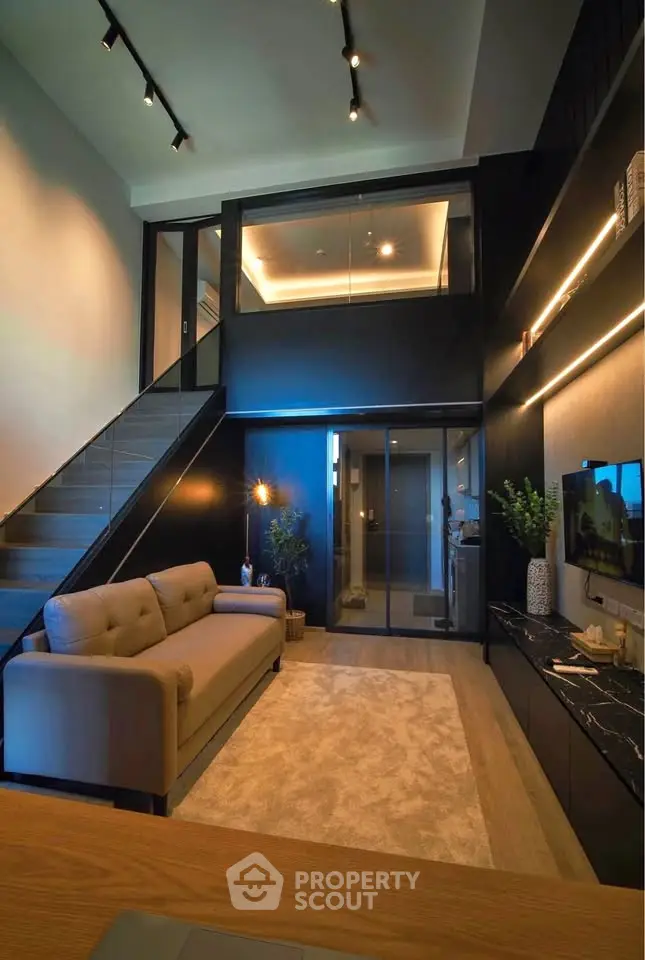 Modern duplex living room with high ceiling and stylish decor