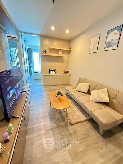 Modern living room with stylish decor and cozy seating in a contemporary apartment.