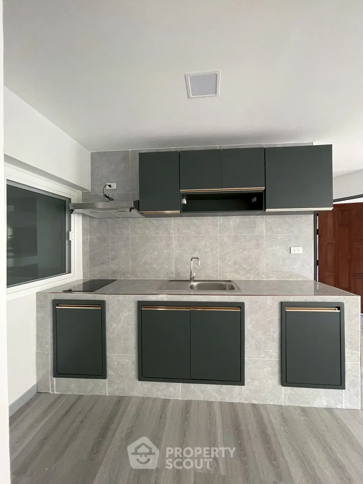 Modern kitchen with sleek cabinetry and minimalist design