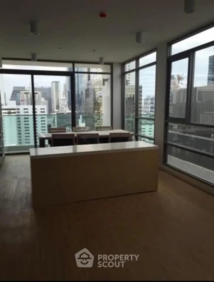 Modern high-rise apartment with stunning city view and open layout