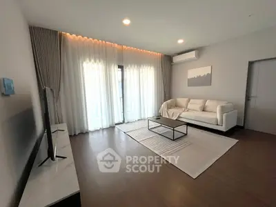 Spacious modern living room with elegant decor and natural light