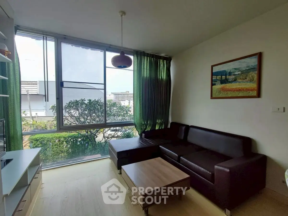 Modern living room with large window and stylish decor