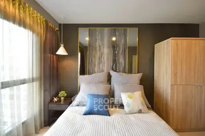 Modern bedroom with stylish decor and ample natural light