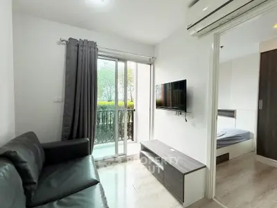 Modern living room with balcony access and sleek interior design