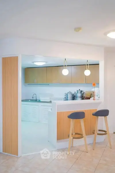 Modern kitchen with open layout and stylish bar stools