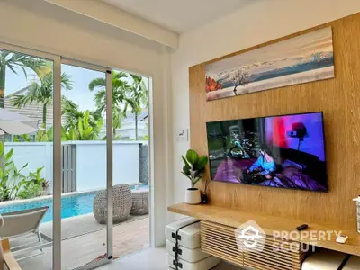 Modern living room with pool view and stylish decor